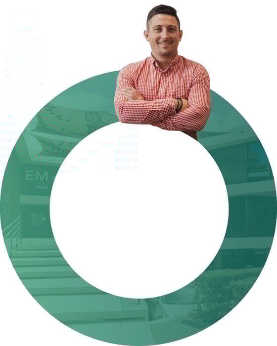 A smiling man, guiding a client to success with EM Group.