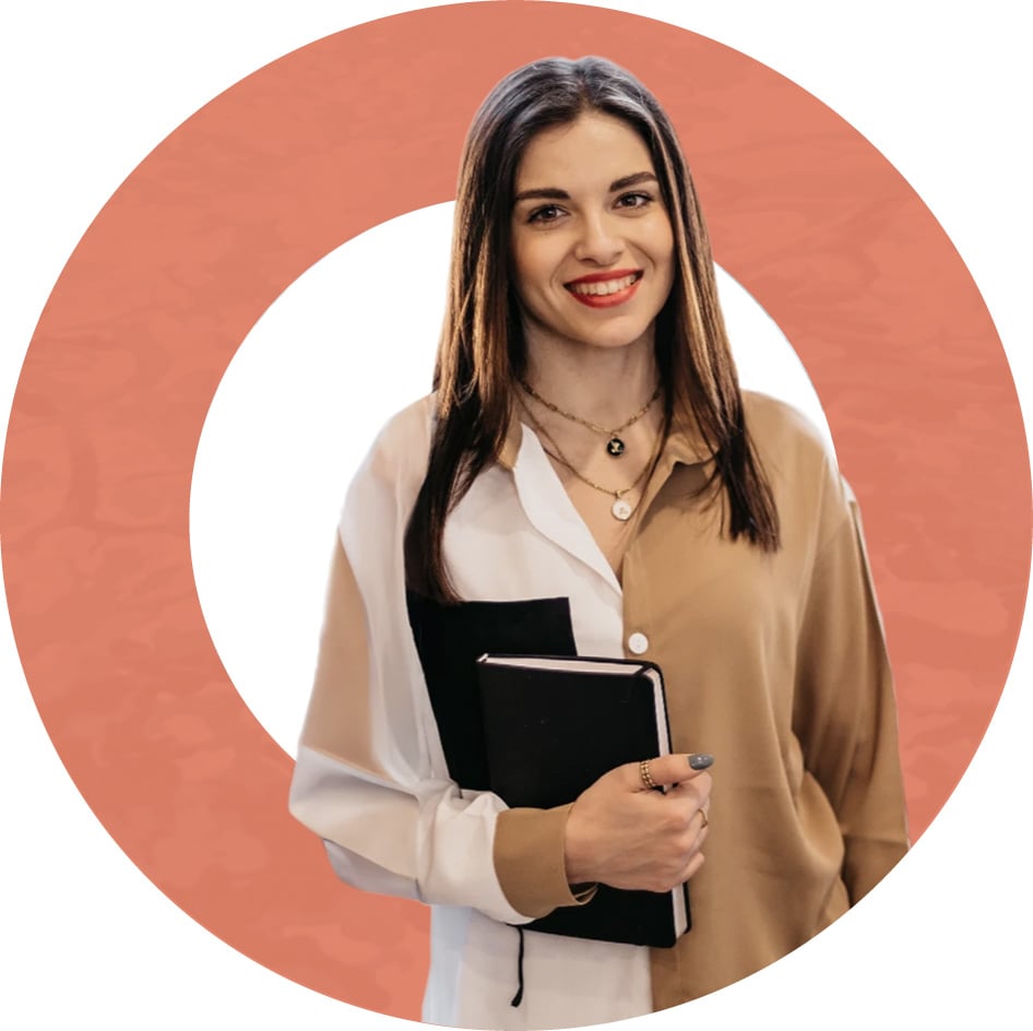 A woman holding a notebook, smiling, ready to provide customized solutions for your business needs